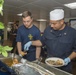 Service members celebrate people aboard USNS Mercy born in May