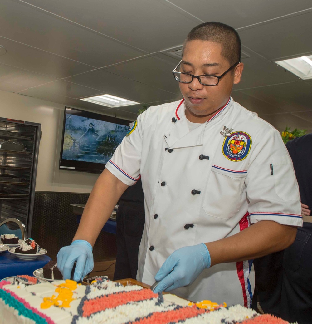 Service members celebrate people aboard USNS Mercy born in May