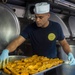 Sailors prepare for lunch aboard USNS Mercy