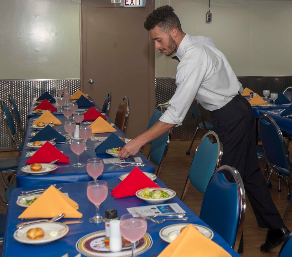 Service members celebrate people aboard USNS Mercy born in May