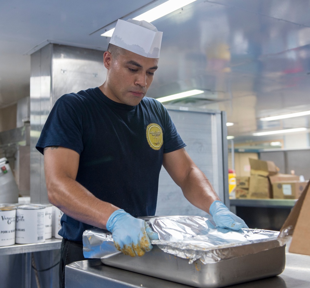 Sailors prepare for lunch aboard USNS Mercy