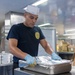 Sailors prepare for lunch aboard USNS Mercy