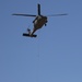 UH-60 sling loads OH-58 frame