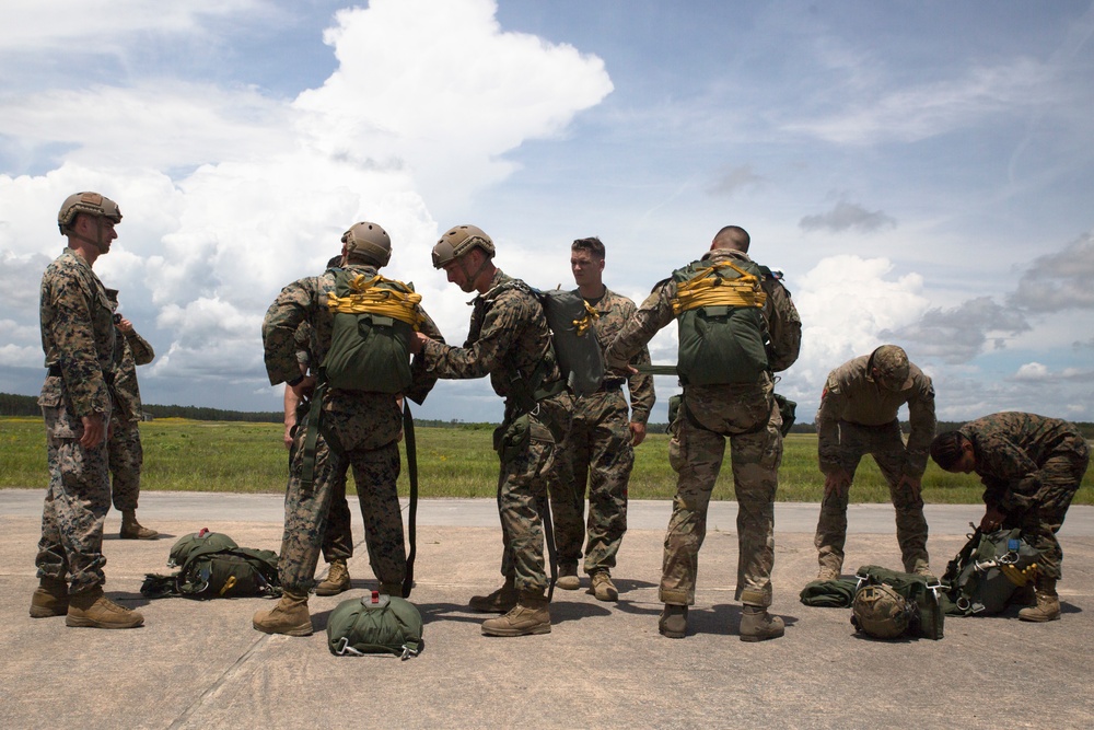 Stand Up, Buckle up, Shuffle to the door: U.S. Marines with II MIG, partner nations parachute during exercise Burmese Chase