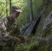 Soldier Sets Up Rope Climbing System