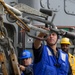 USS Antietam (CG 54) Sailor releases supply line during a replenishment at sea with USNS Cesar Chavez (T-AKE-14)