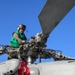 USS Antietam (CG 54) pilot performs a pre-flight inspection on a MH 60-R ‘Seahawk’ helicopter