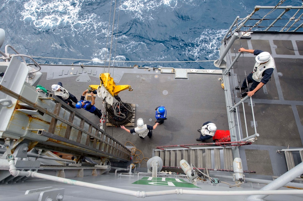 USS Antietam (CG 54) Sailors receive supplies during a replenishment-at-sea (RAS) with USNS Cesar Chavez (T-AKE-14)
