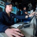 USS Antietam (CG 54) Sailor assists with ship navigation