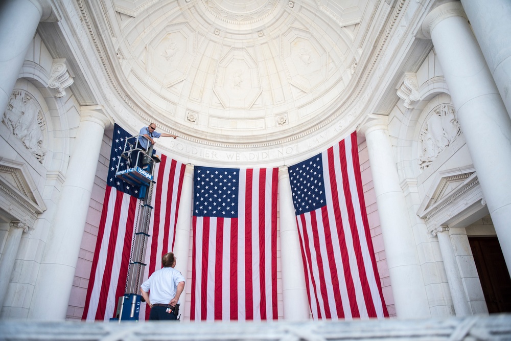 Arlington National Cemetery Employees Hang American Flags in the Memorial Amphitheater