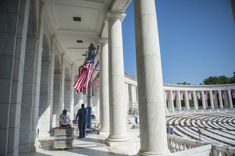 Arlington National Cemetery Employees Hang American Flags in the Memorial Amphitheater