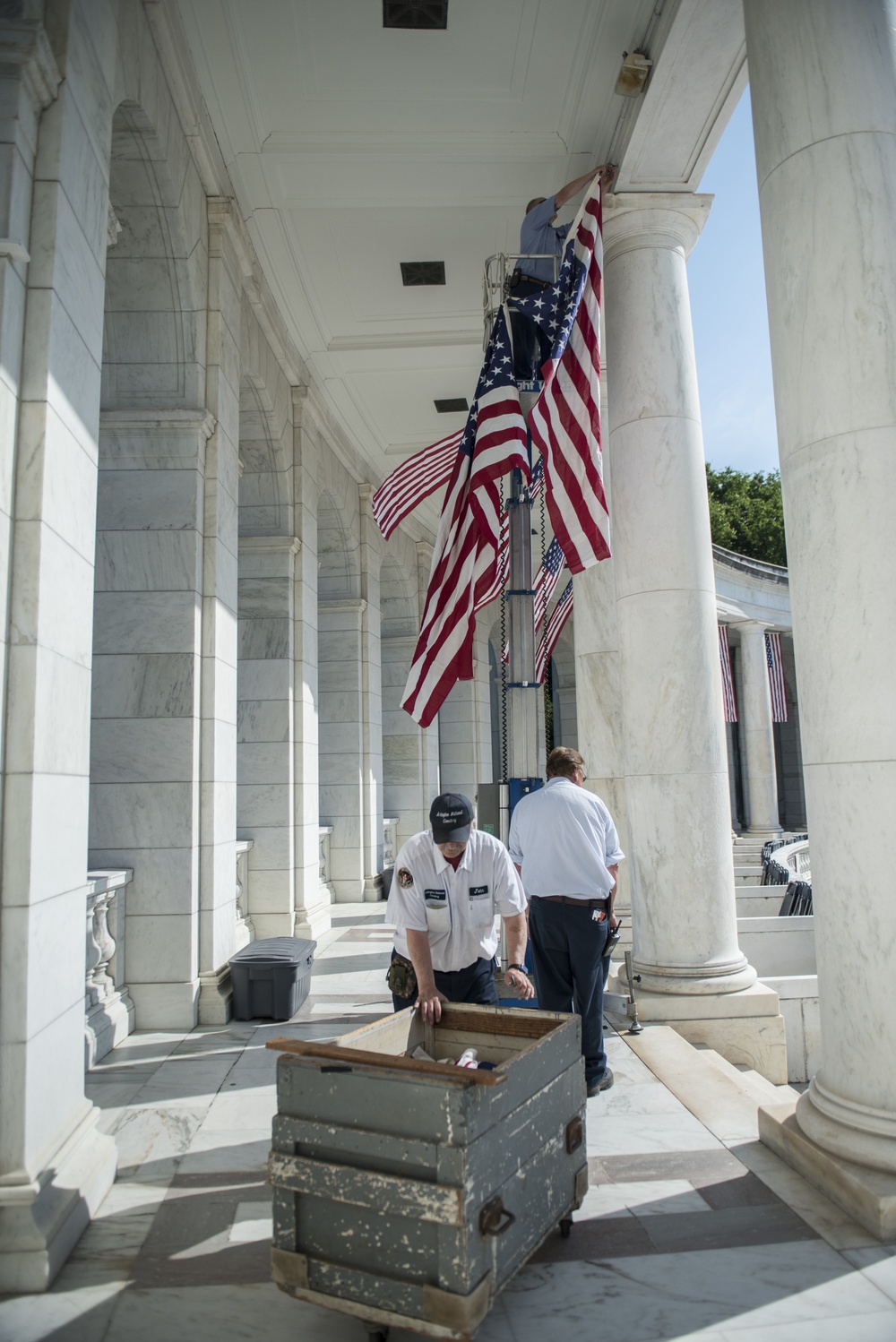 Arlington National Cemetery Employees Hang American Flags in the Memorial Amphitheater