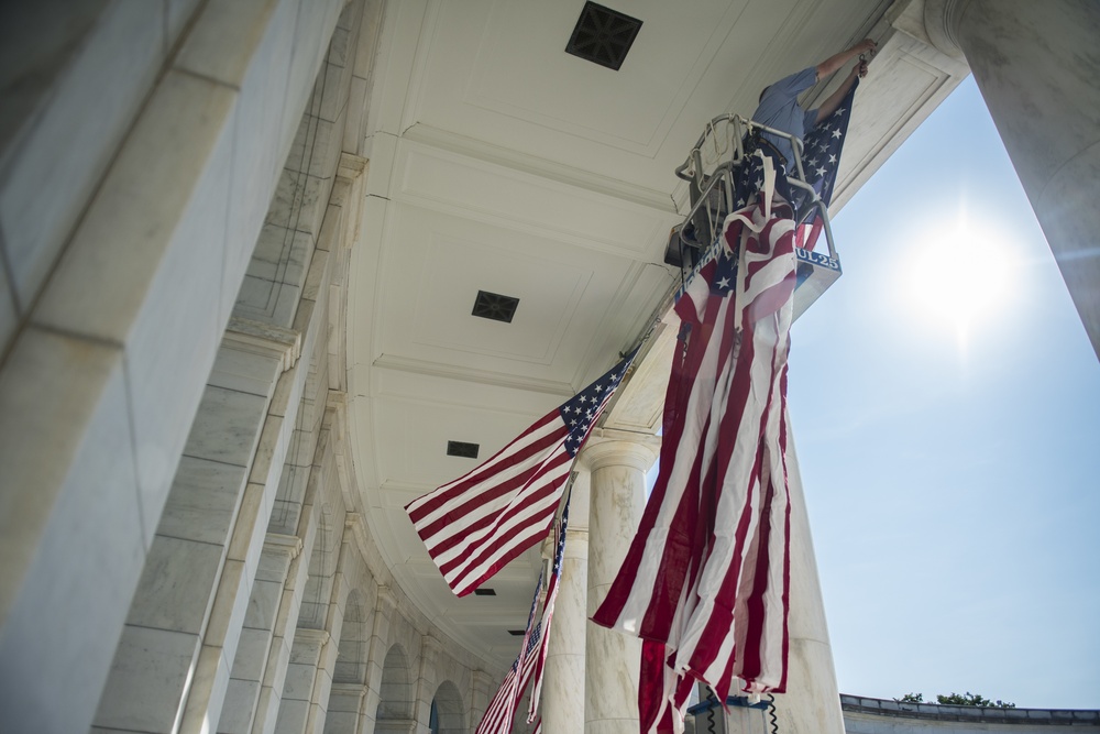 Arlington National Cemetery Employees Hang American Flags in the Memorial Amphitheater