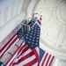 Arlington National Cemetery Employees Hang American Flags in the Memorial Amphitheater