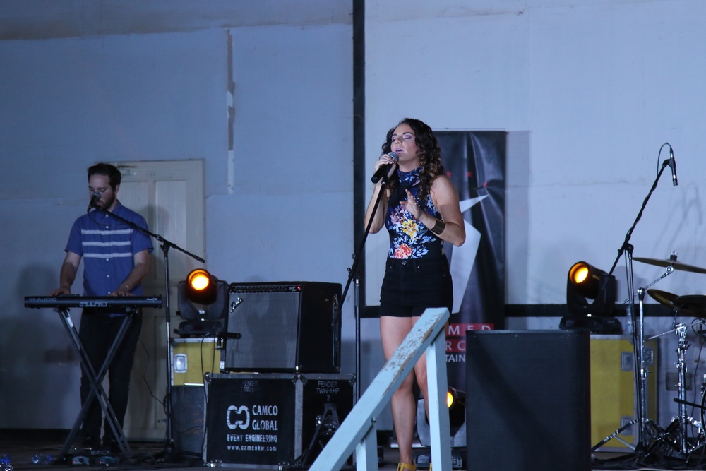 Pop artist Danika Portz performs for service members training in Kuwait, Jordan