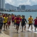 PP18 servicemembers join Vietnamese swimmers in a surf lifesaving event.