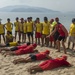 PP18 servicemembers join Vietnamese swimmers in a surf lifesaving event.