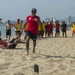 PP18 servicemembers join Vietnamese swimmers in a surf lifesaving event.
