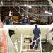 Coast Guard aviation personnel maintain C-130 aircraft