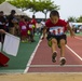 Children from the local and US communities compete in track meet