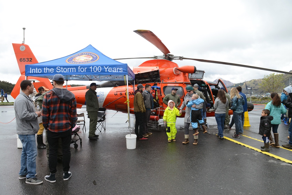 Coast Guard Air Station Kodiak MH-65 Dolphin helicopter and crew at Kodiak Crab Festival