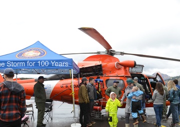 Coast Guard Air Station Kodiak MH-65 Dolphin helicopter and crew at Kodiak Crab Festival