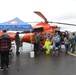 Coast Guard Air Station Kodiak MH-65 Dolphin helicopter and crew at Kodiak Crab Festival
