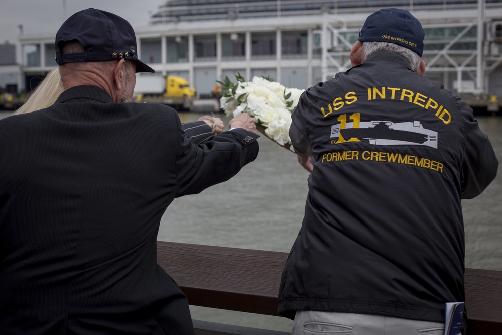 Marines, Sailors and Coast Guardsmen take part in a Memorial Day ceremony