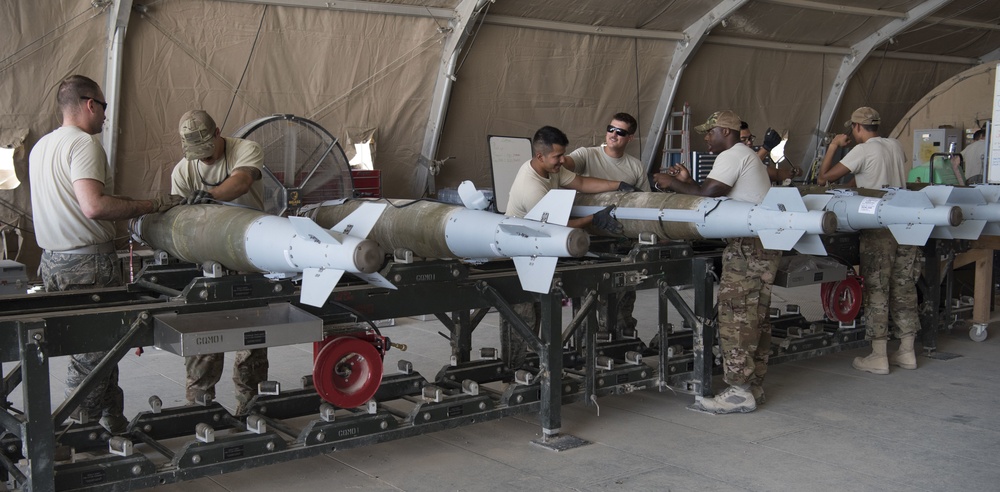 332nd EMXS Munitions Flight arms up F-15s