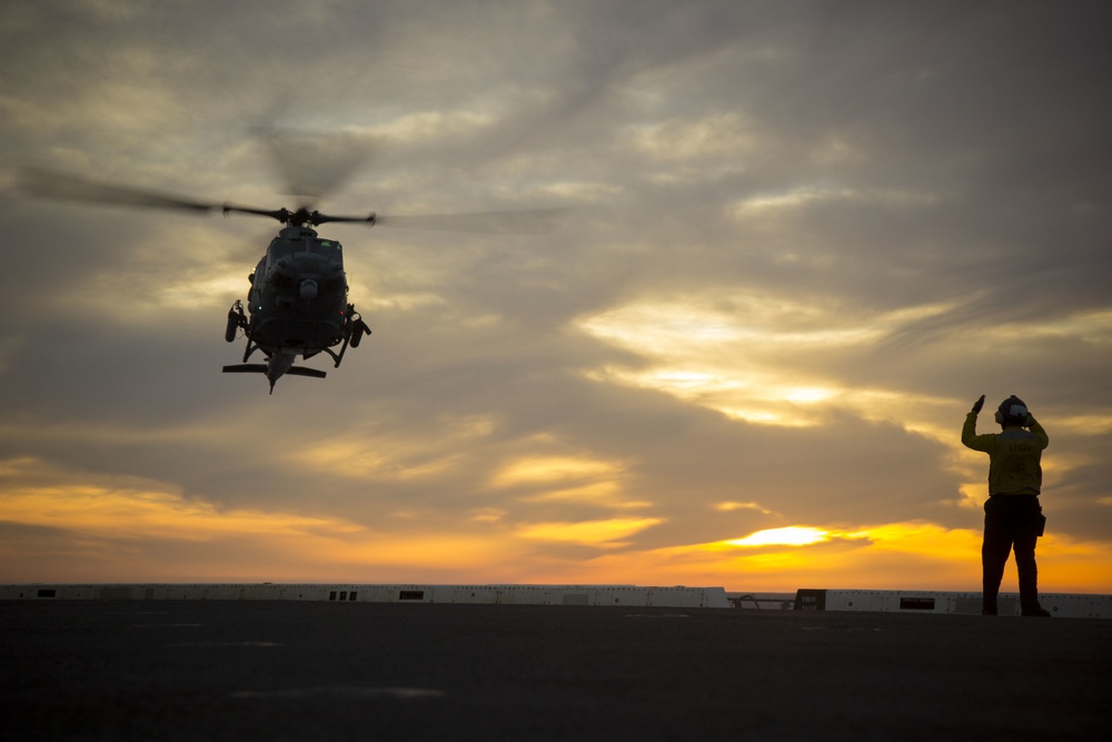 Sunset flight operations aboard the USS New York