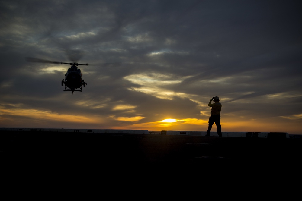 Sunset flight operations aboard the USS New York