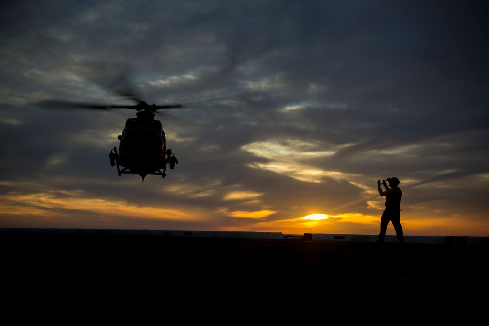 Sunset flight operations aboard the USS New York