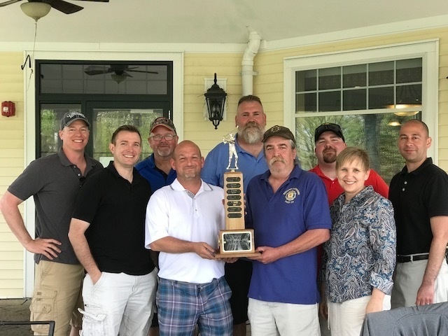 Ugly rug upstages trophy at Golf tourney