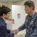 Henry Kim is presented a coin by NHCPR Commanding Officer