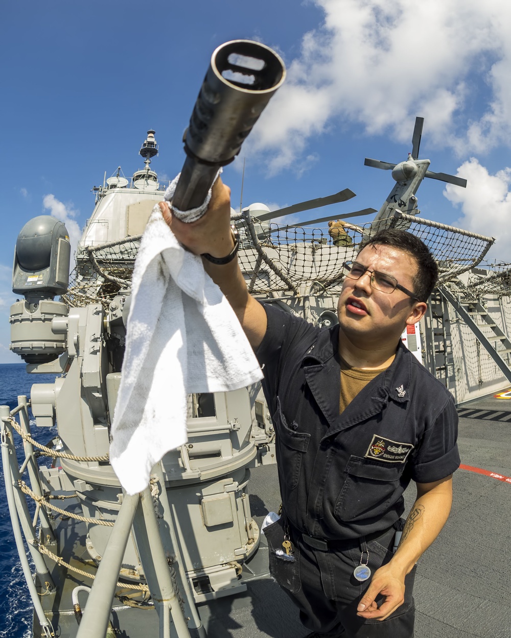 USS Antietam (CG 54) Sailor cleans a M38 25mm anti-surface gun