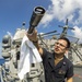 USS Antietam (CG 54) Sailor cleans a M38 25mm anti-surface gun