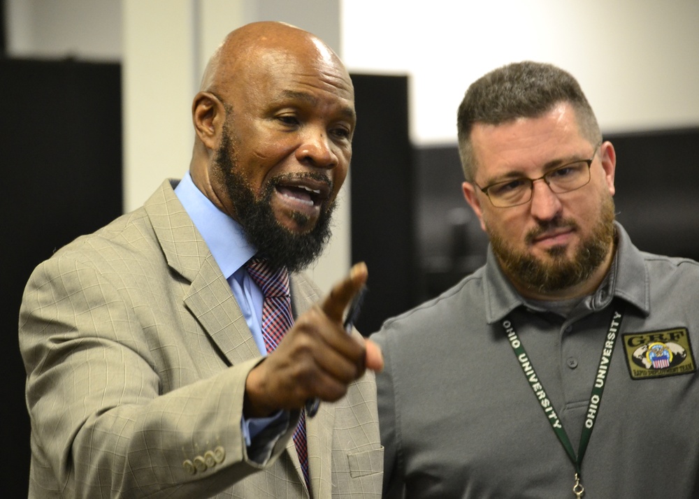 DLA RDT Red Team deputy commander Archie Turner (left) and RDT Red Team operations officer Taylor Frazier III address Troop Support employees during a humanitarian relief and disaster recovery exercise May 22 in Philadelphia.