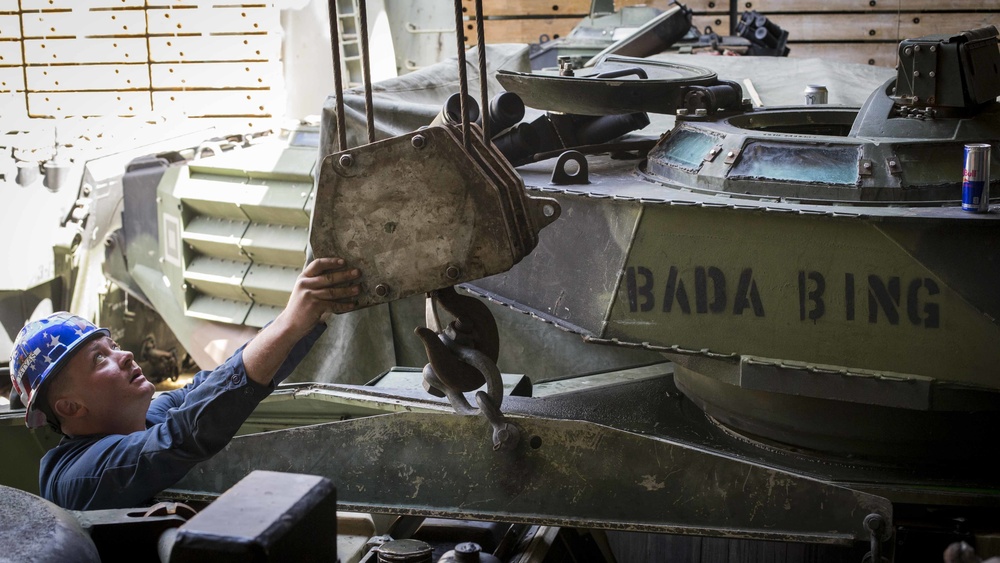 AAV Marines replace engine on ship