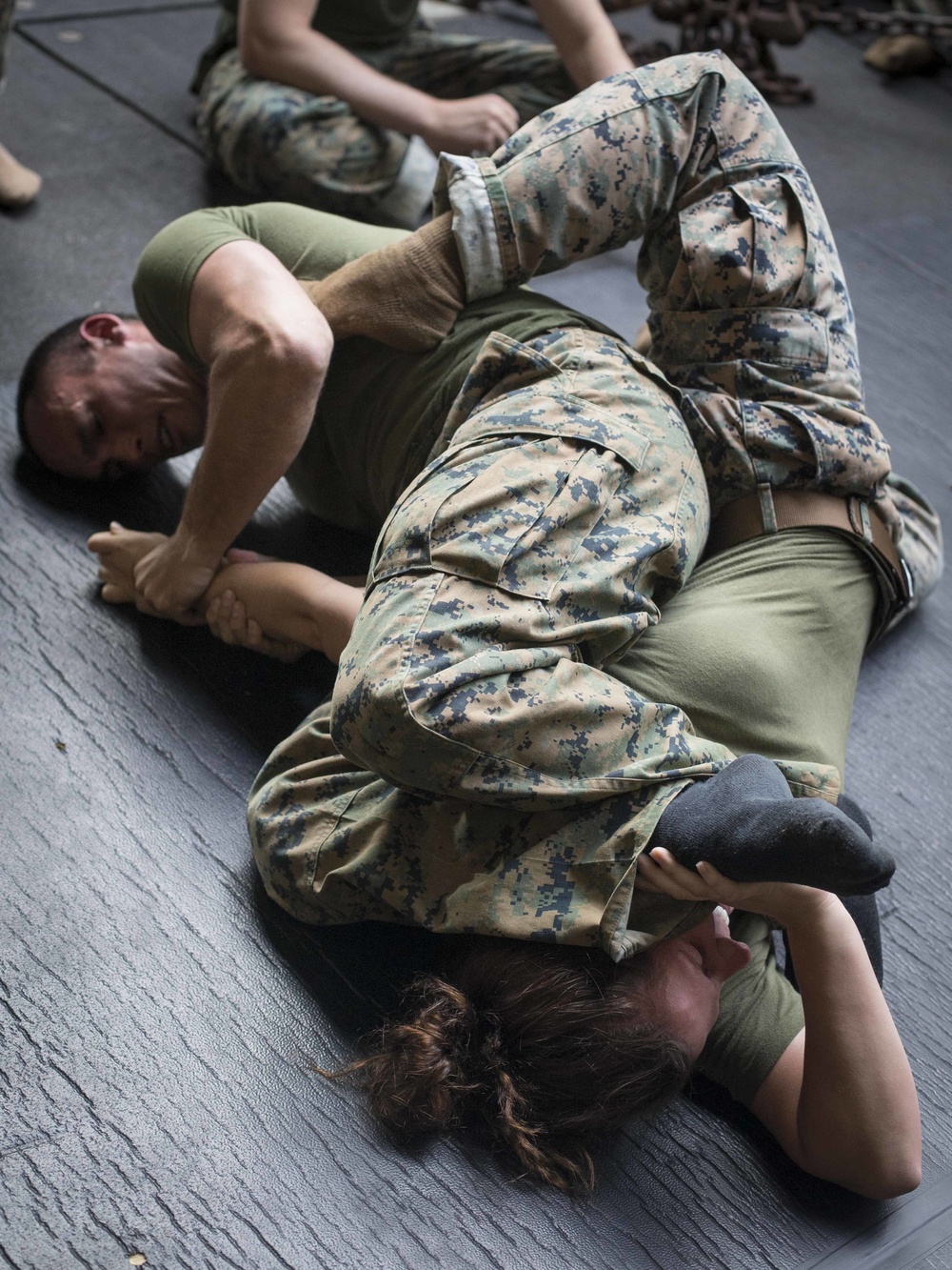 Combat Logistics Battalion 13 and Battalion Landing Team 3/1 practice grappling techniques