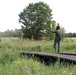 Polish soldier guides U.S. Stryker across wet gap