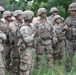 Polish soldier gives direction to U.S. Army soldiers from Battle Group Poland