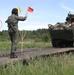 Polish soldier guides U.S. Army Stryker