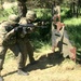 Polish soldiers demonstrate weapon handling for U.S. Army soldiers