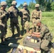 Polish soldier instructs U.S. Army soldiers on IED identification