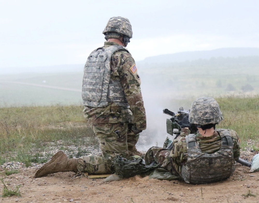 Sgt. Eric N. Fryer Assists Soldier on Range