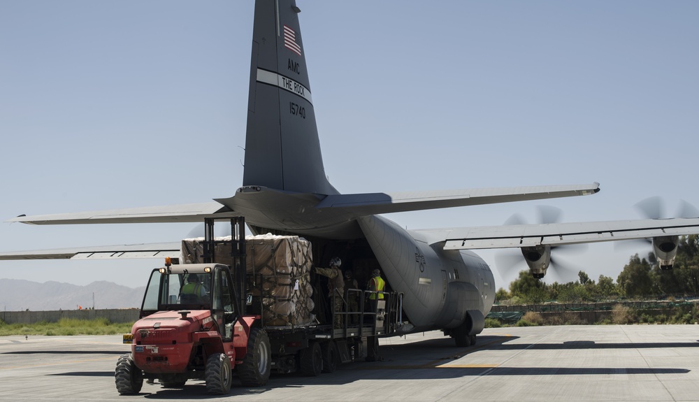 Fly Away Security Team Provides Security for a C-130 while Loading and Unloading Equipment