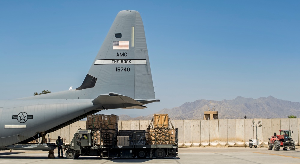 Fly Away Security Team Provides Security for a C-130 while Loading and Unloading Equipment