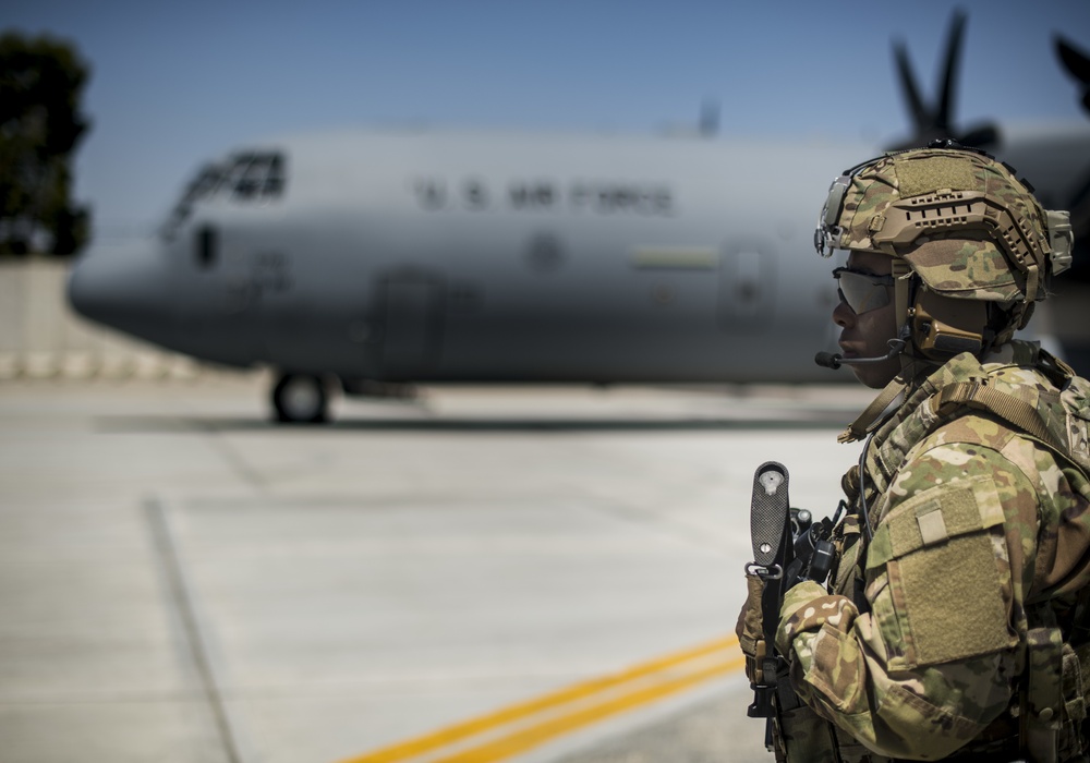 Fly Away Security Team Provides Security for a C-130 while Loading and Unloading Equipment