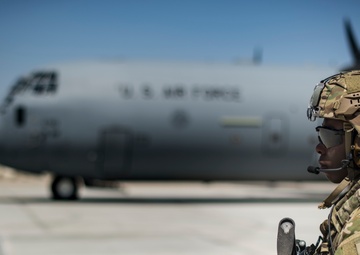 Fly Away Security Team Provides Security for a C-130 while Loading and Unloading Equipment