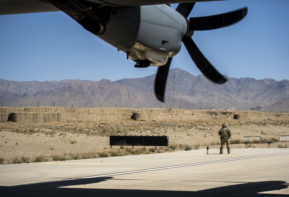 Fly Away Security Team Provides Security for a C-130 while Loading and Unloading Equipment